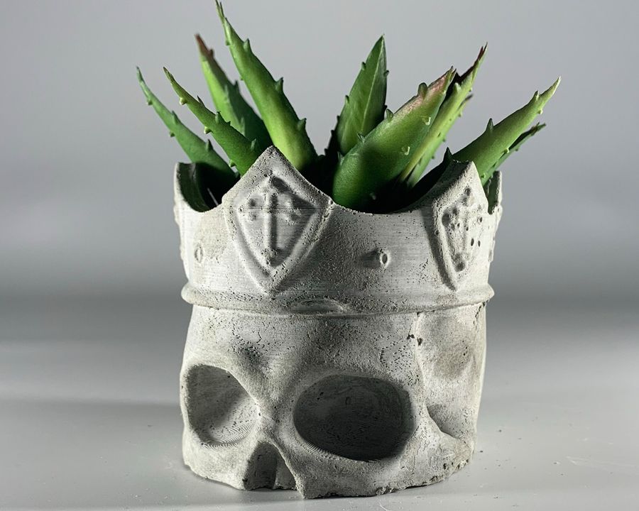 Concrete skull wearing a crown